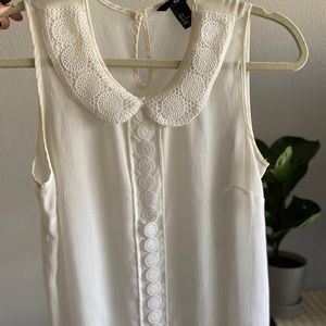 White sleeveless top